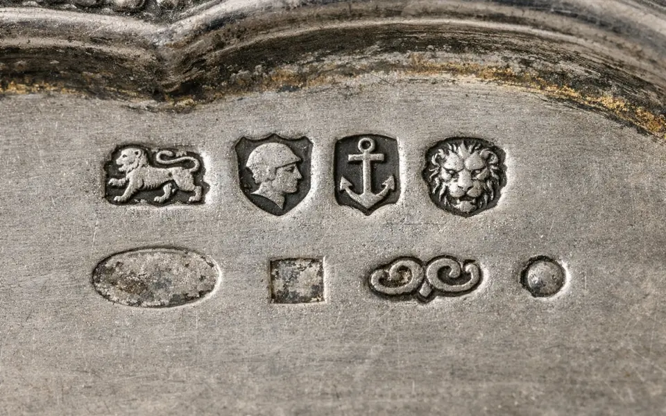 Close-up visual clues that help distinguish antique silver marks